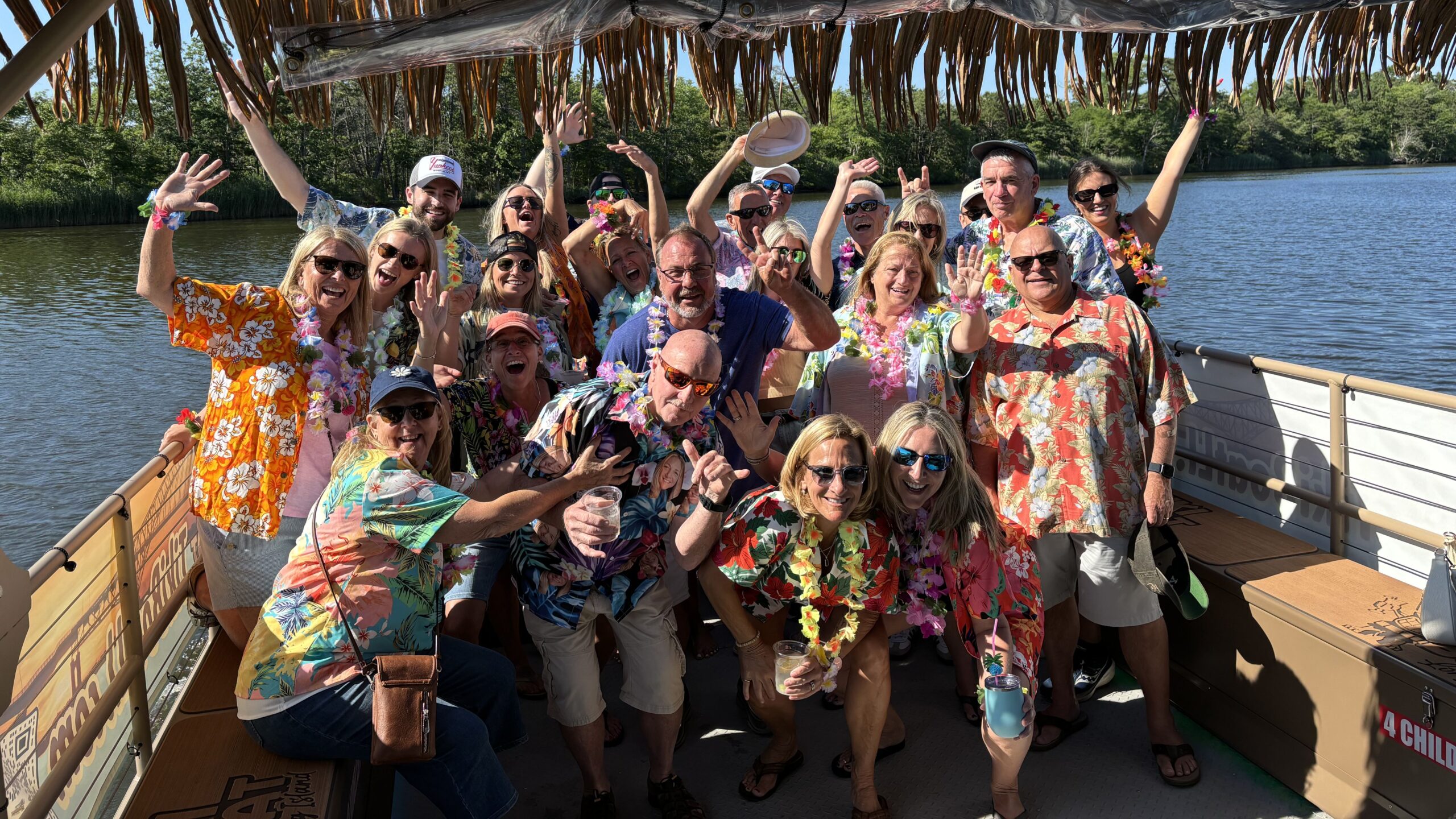 Guests celebrating aboard the Tiki Boat Long Island party deck