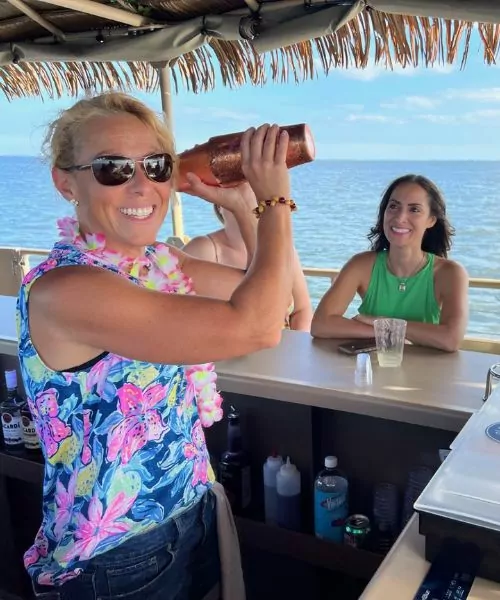 Tiki boat cruising on Long Island waterfront